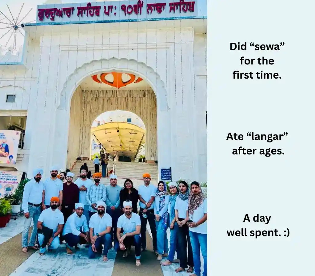 A group of people getting clicked against the backdrop of Nada Sahib. 