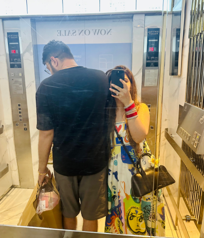 Heena from HeenaInTheWonderland with her husband, Pratyaksh, in an empty lift inside the empty Central Phuket Mall.