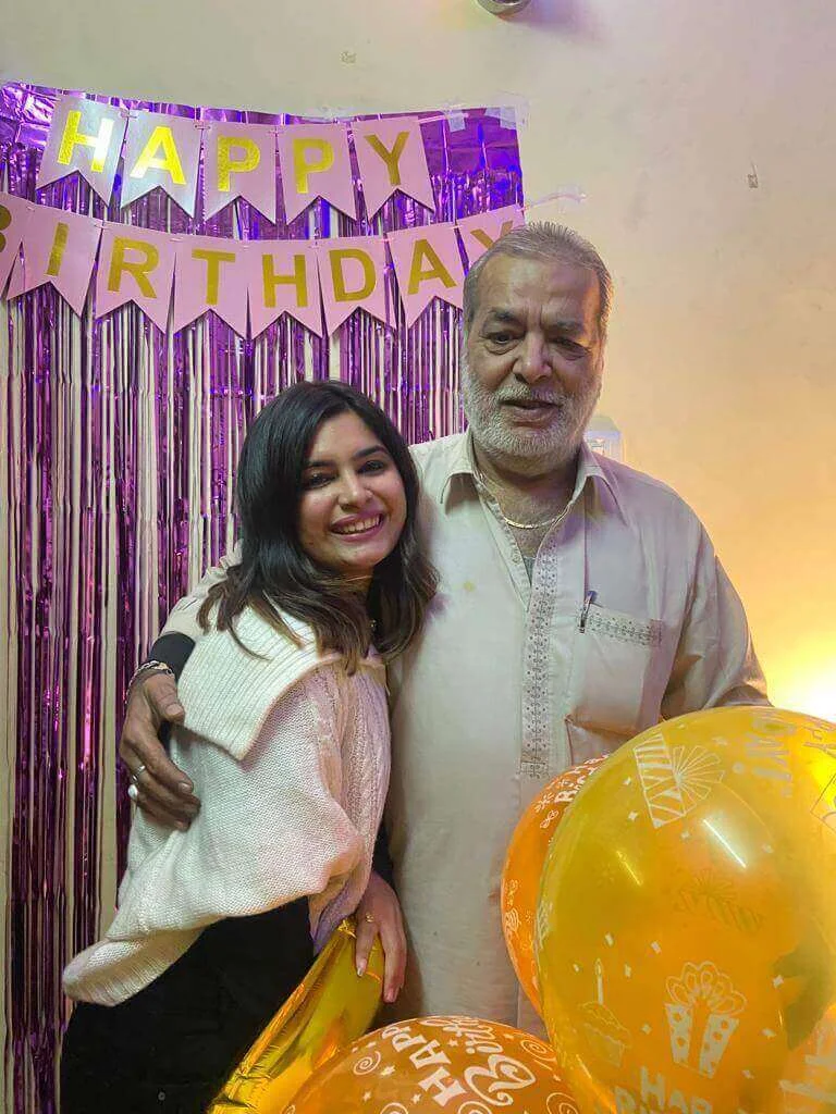 A daughter hugging her father